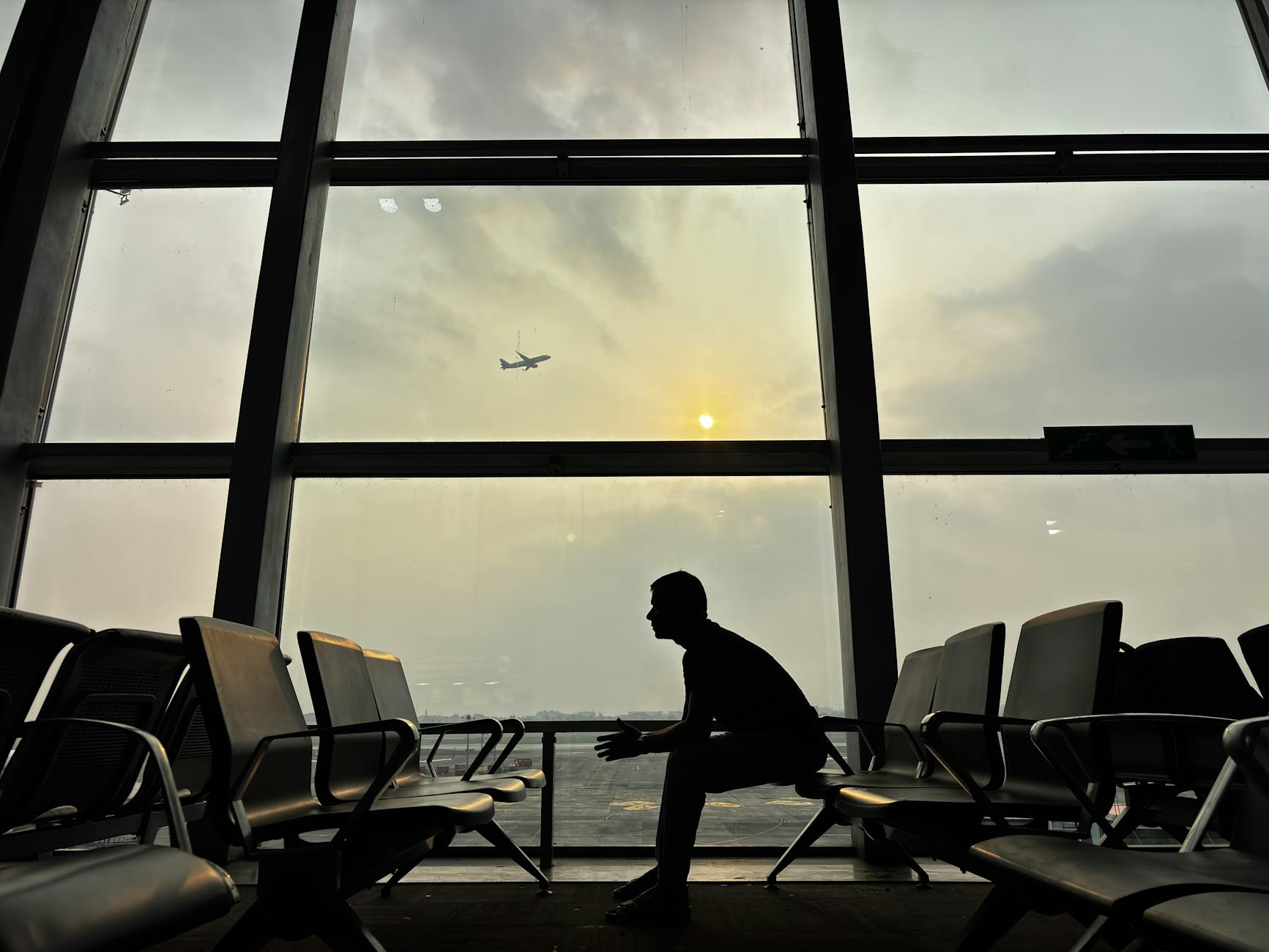 silhouette of man in kolkata airport terminal