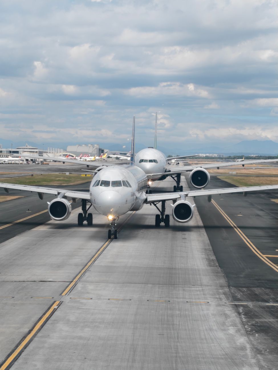 commercial airplanes on runway at pasay city airport