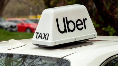 uber taxi sign on car roof in wroclaw