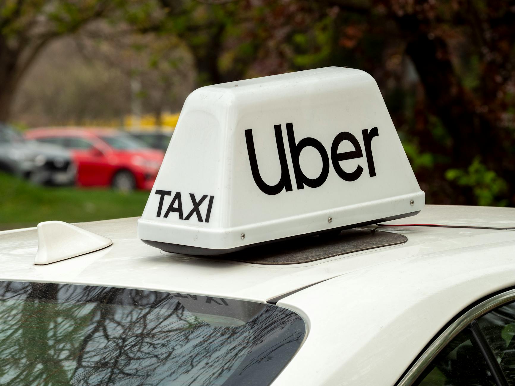 uber taxi sign on car roof in wroclaw