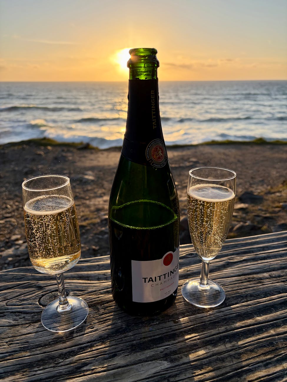 champagne and sunset by the beach for two