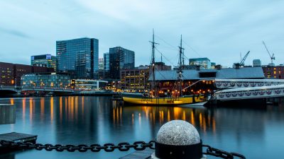 boston skyline with historic ship at twilight