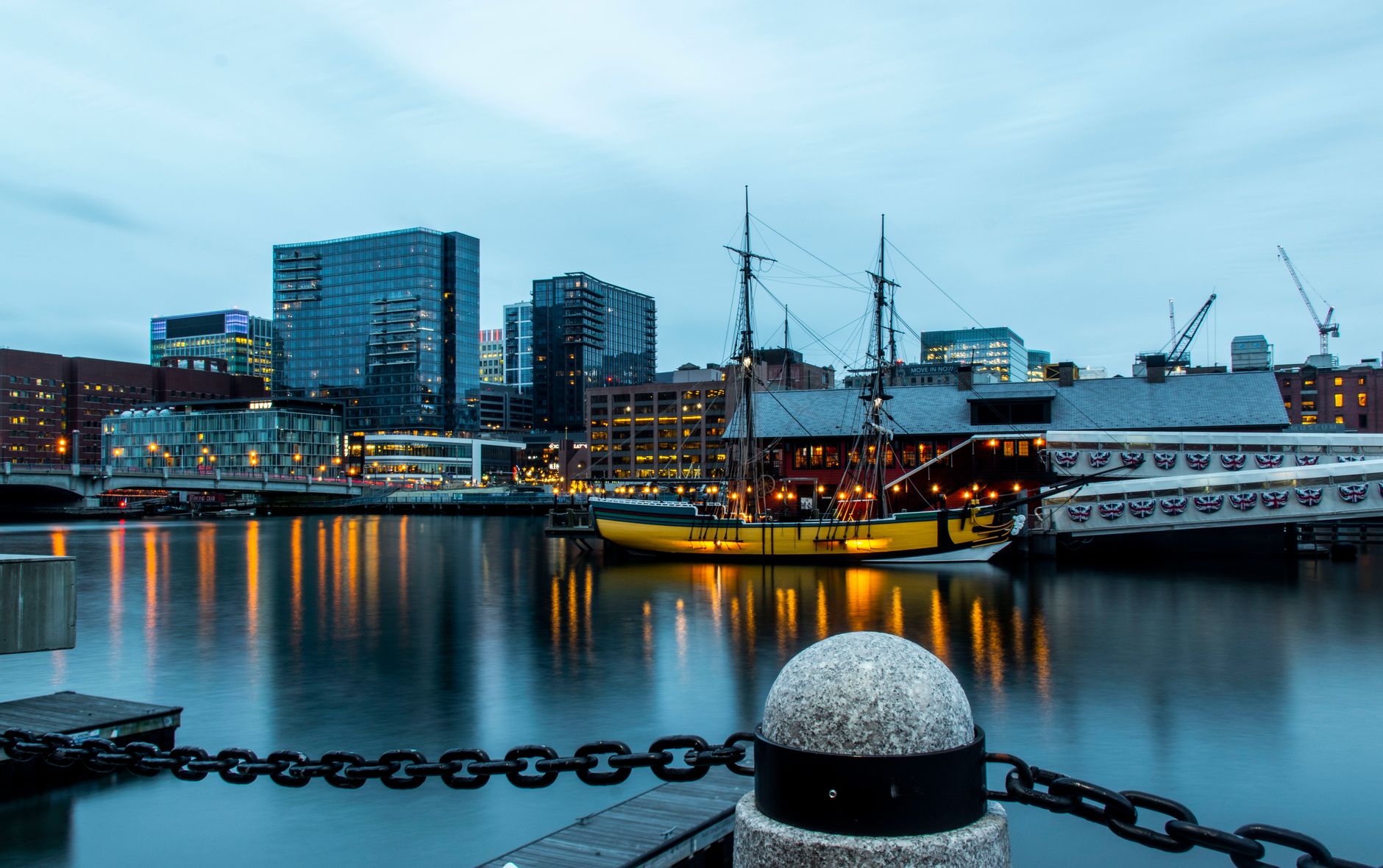 boston skyline with historic ship at twilight