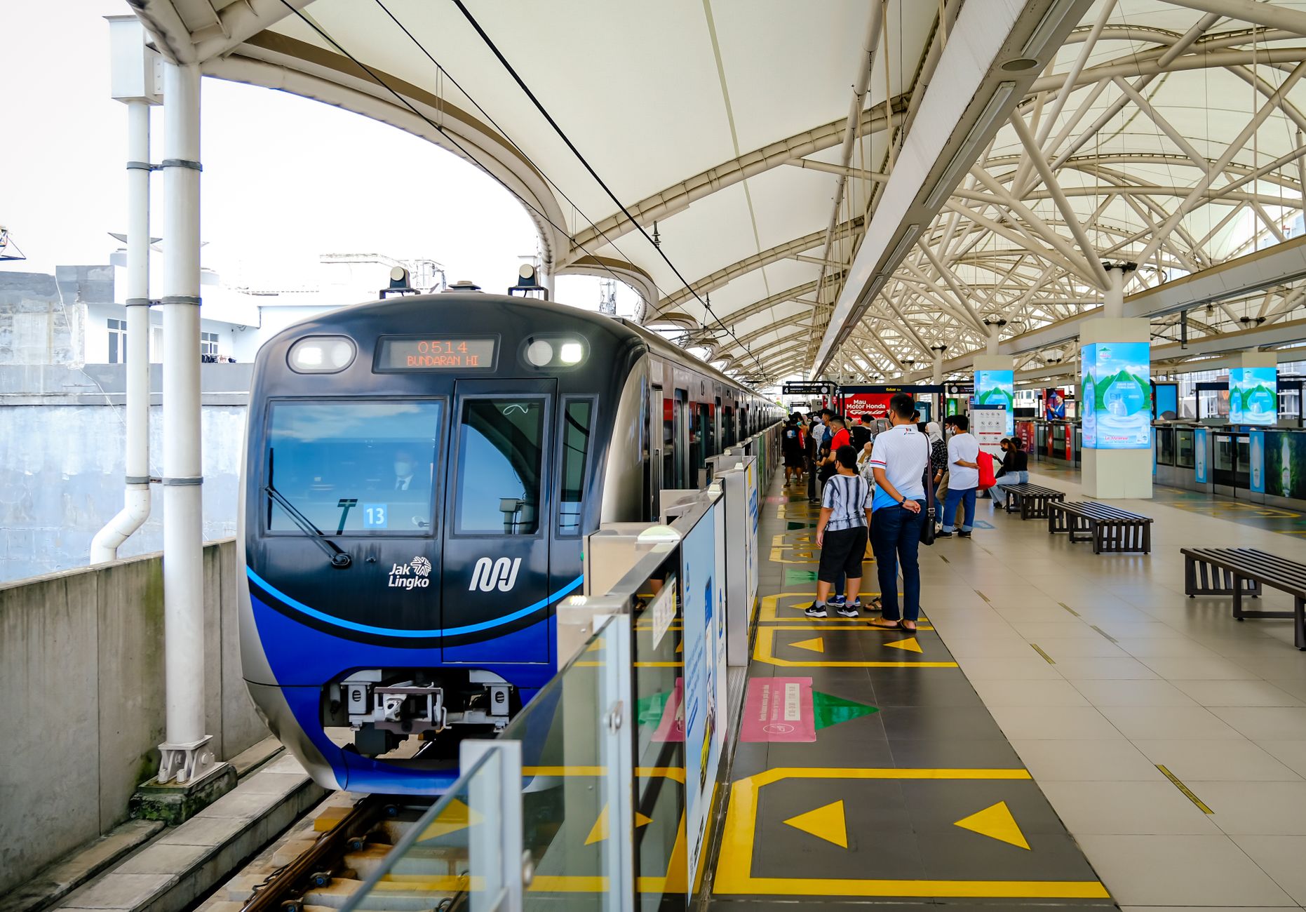 modern jakarta mrt station with commuter train