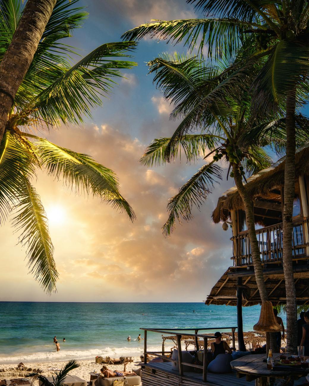 brown wooden house on beach