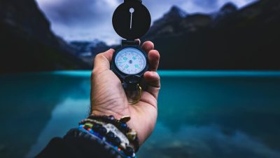 person holding a compass