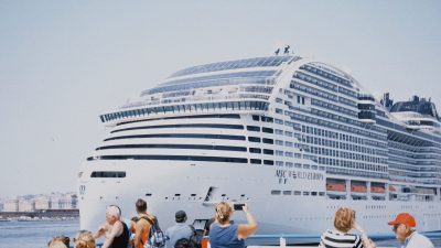 tourists observing cruise ship msc world europa