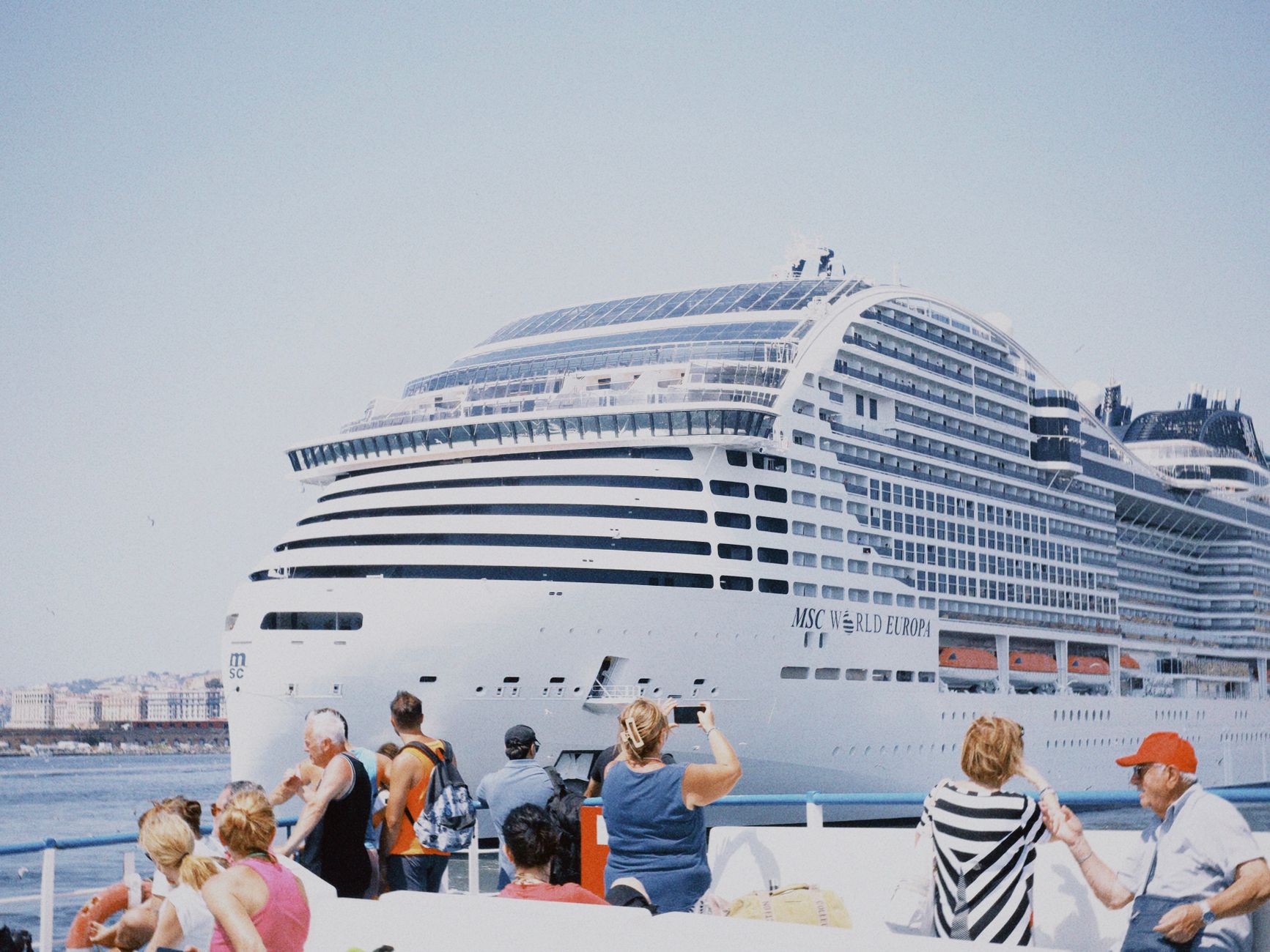 tourists observing cruise ship msc world europa