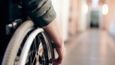 person sitting on wheelchair