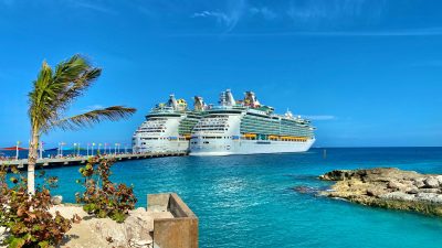 luxury liners sailing on bright ocean near city port