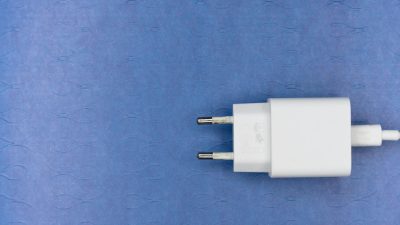 white adapter on a blue surface