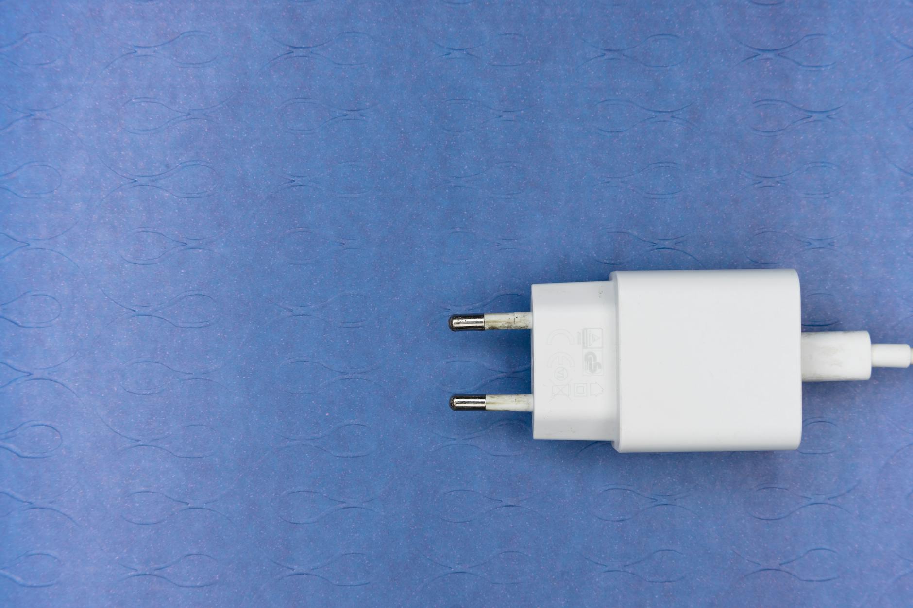 white adapter on a blue surface