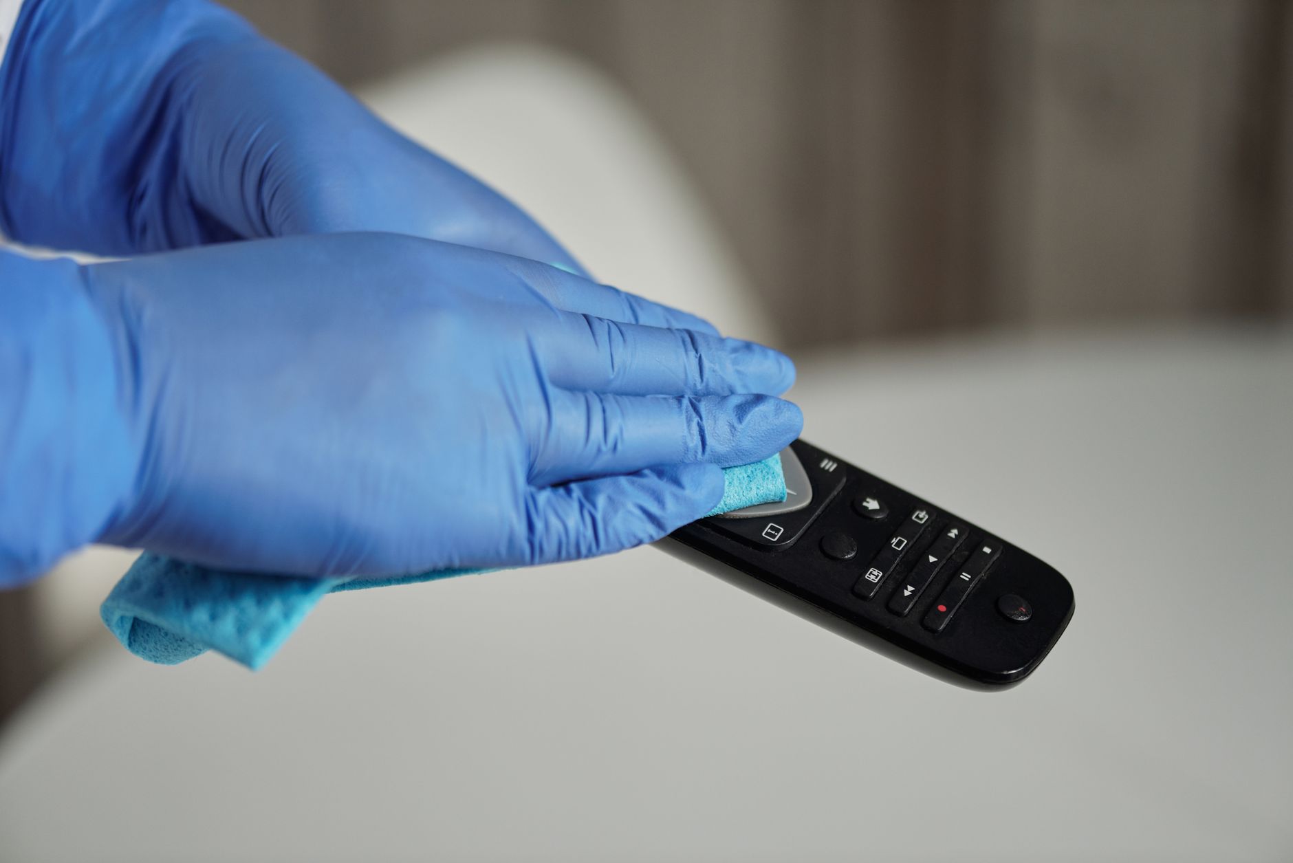 person holding black remote control