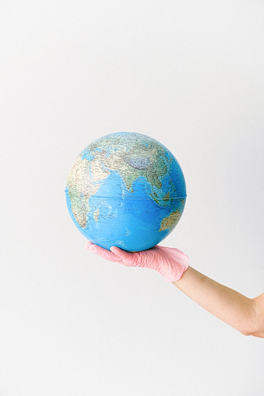 a person holding a globe