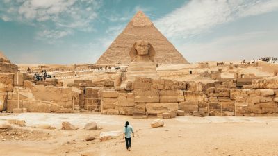 tourist walking towards historical architectural monument