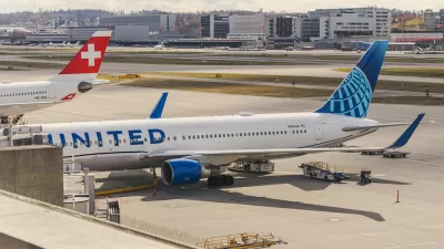 airplanes waiting in airport on airstrip