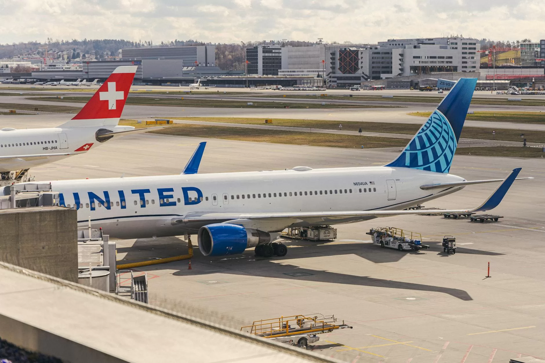 airplanes waiting in airport on airstrip
