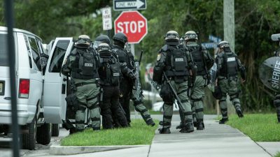 armed combat forces on american street