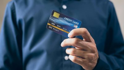 person holding a credit card card