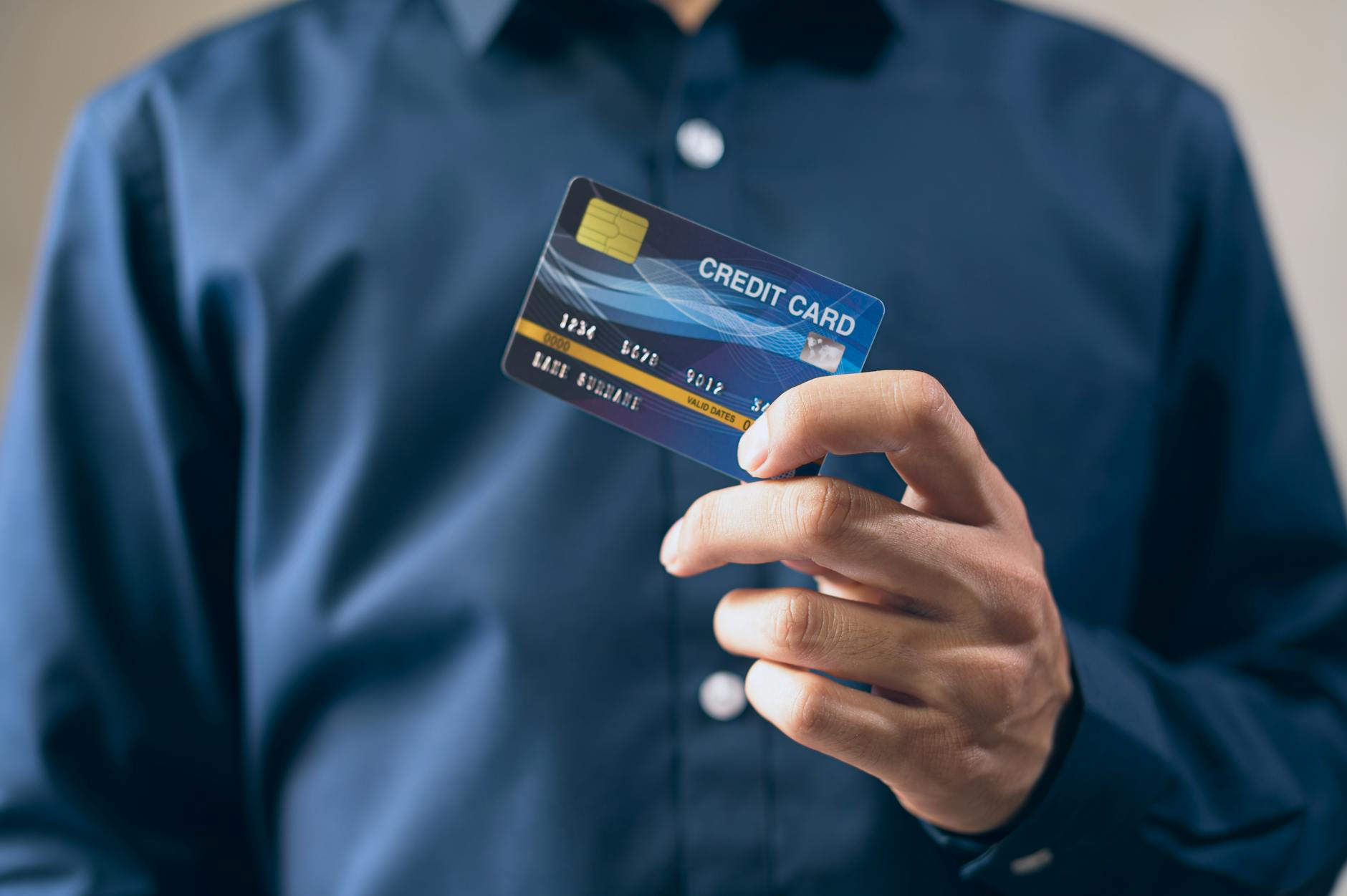 person holding a credit card card