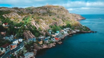 small houses spread around rocky coast