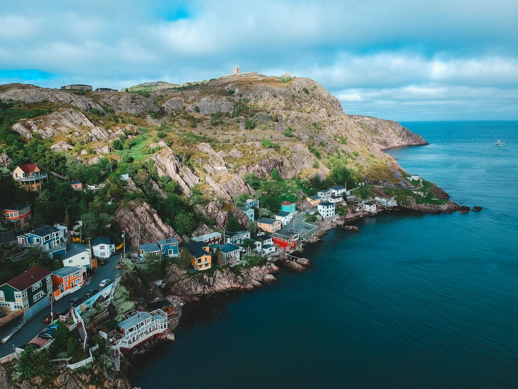 small houses spread around rocky coast