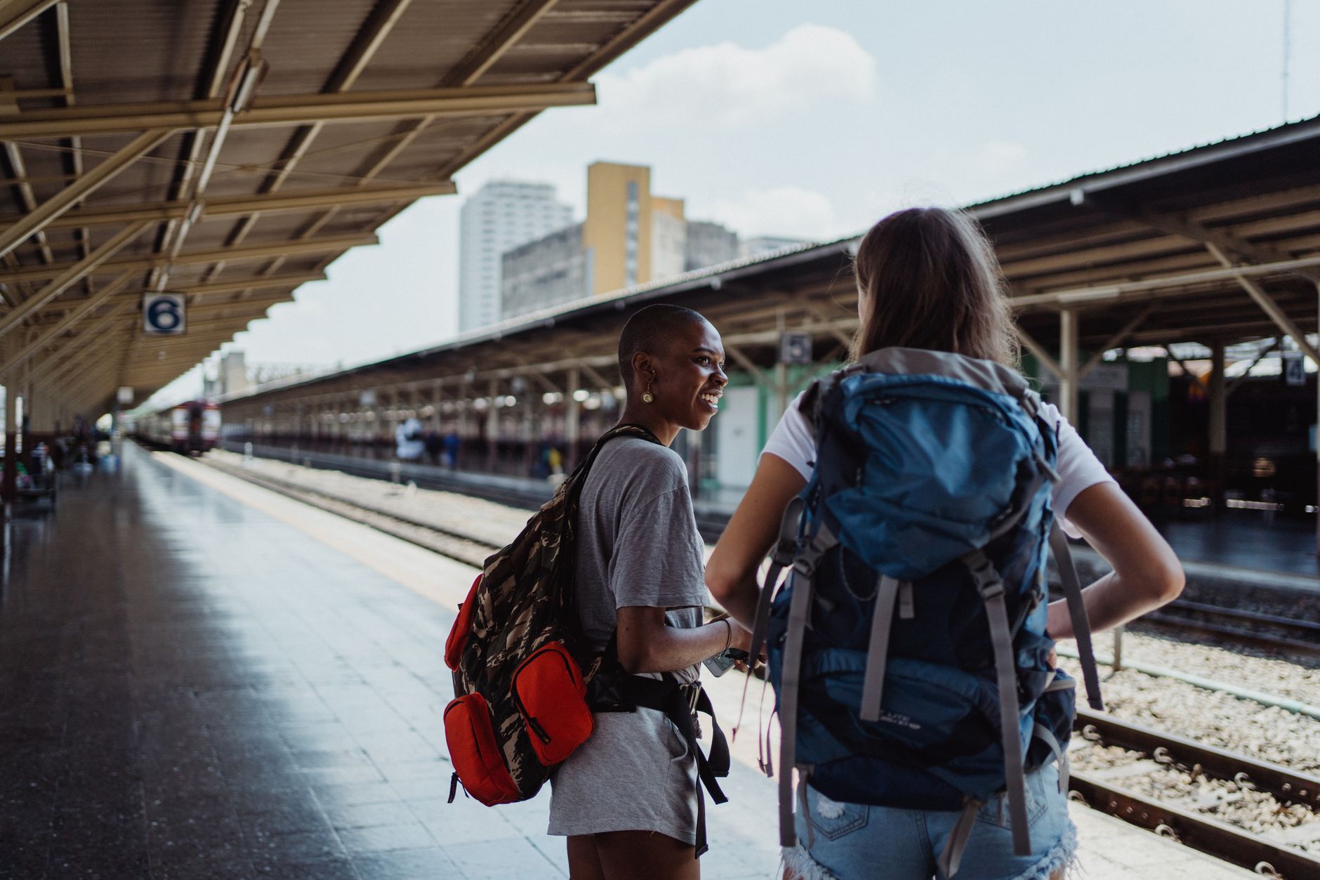 women standing at the platform