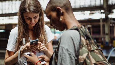 tourists checking their smart phones