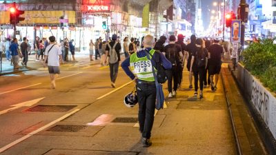people walking on the street at night