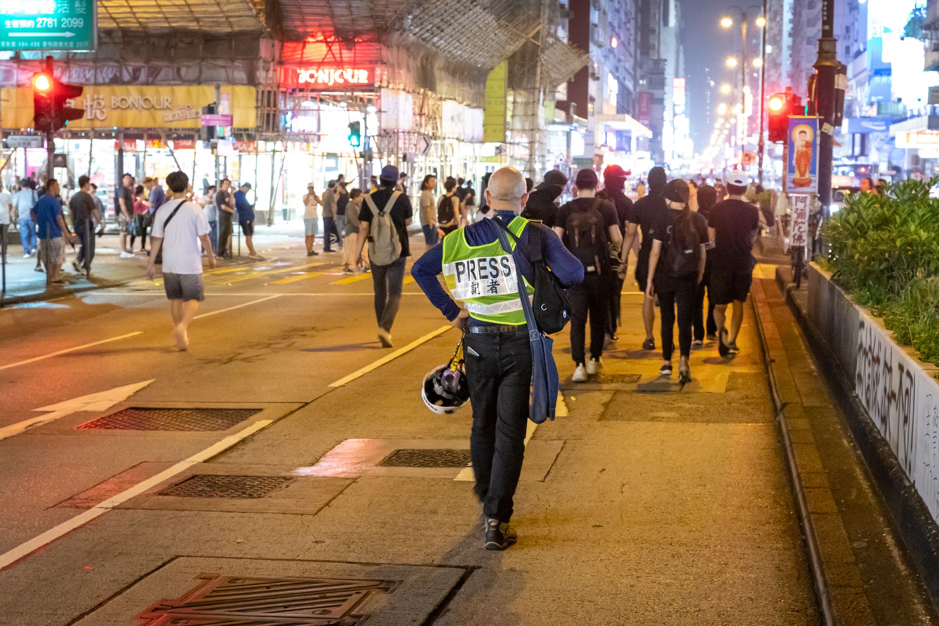 people walking on the street at night