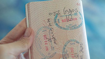 person holding an opened passport