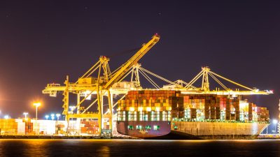cargo ship on dock during nighttime