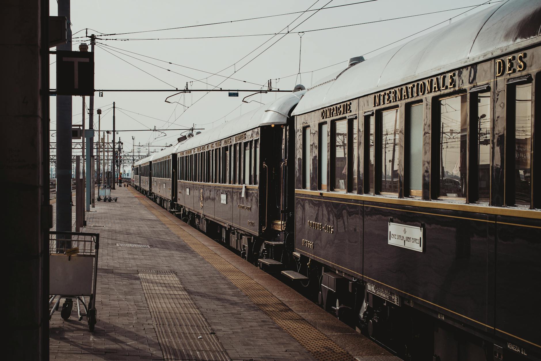 old fashioned train parked on railroad station