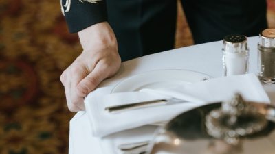 bellboy pulling a serving tray