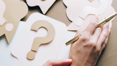 hands on top of paper crafts