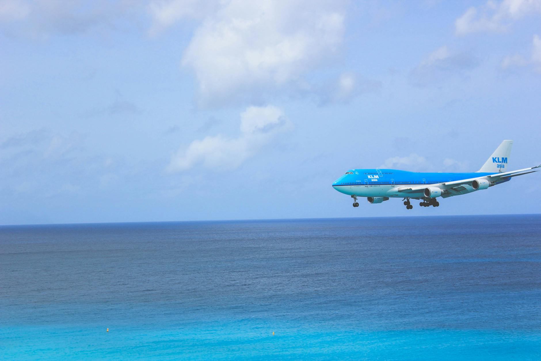 white and blue passenger plane