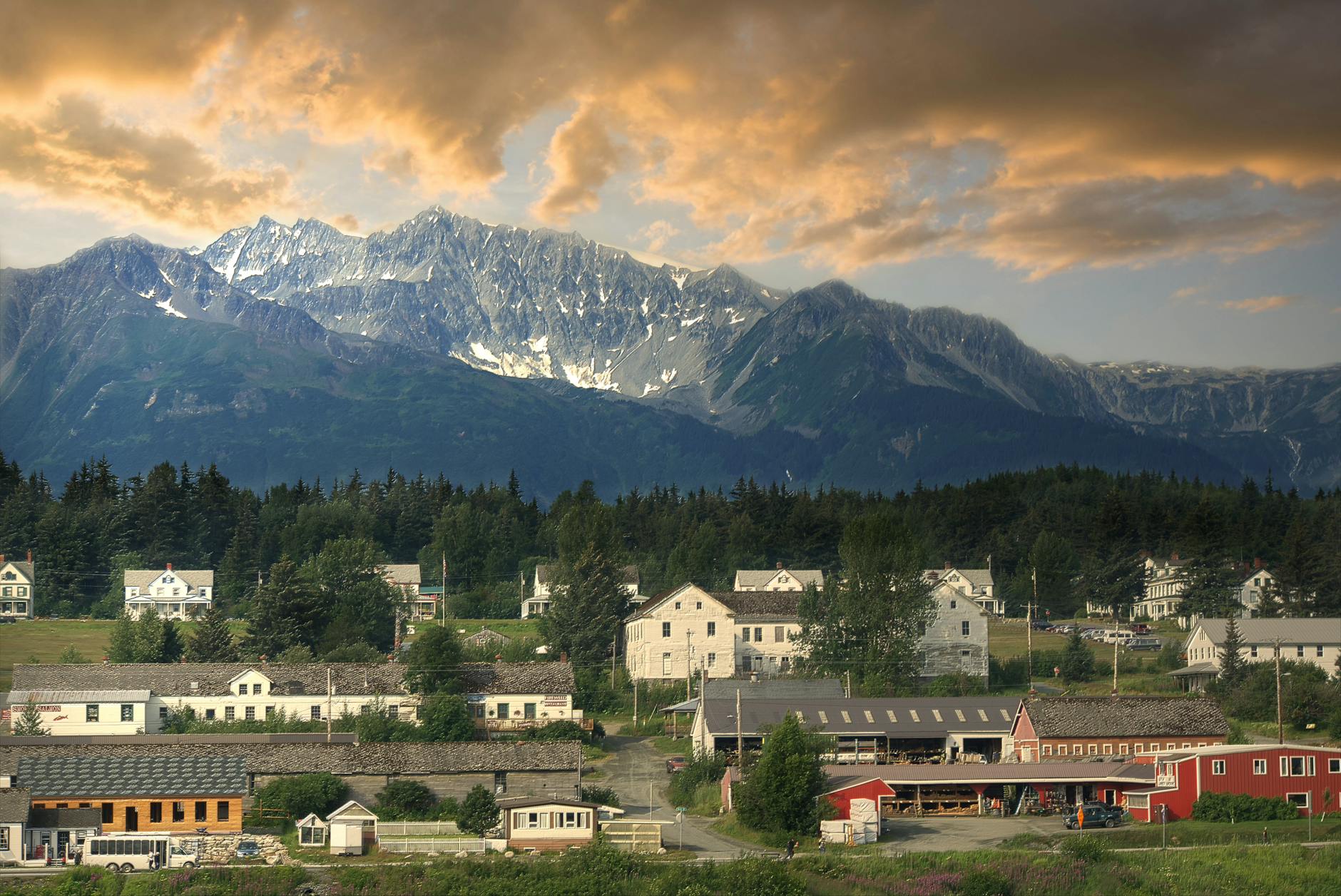 photo of a town with a mountain range in the background