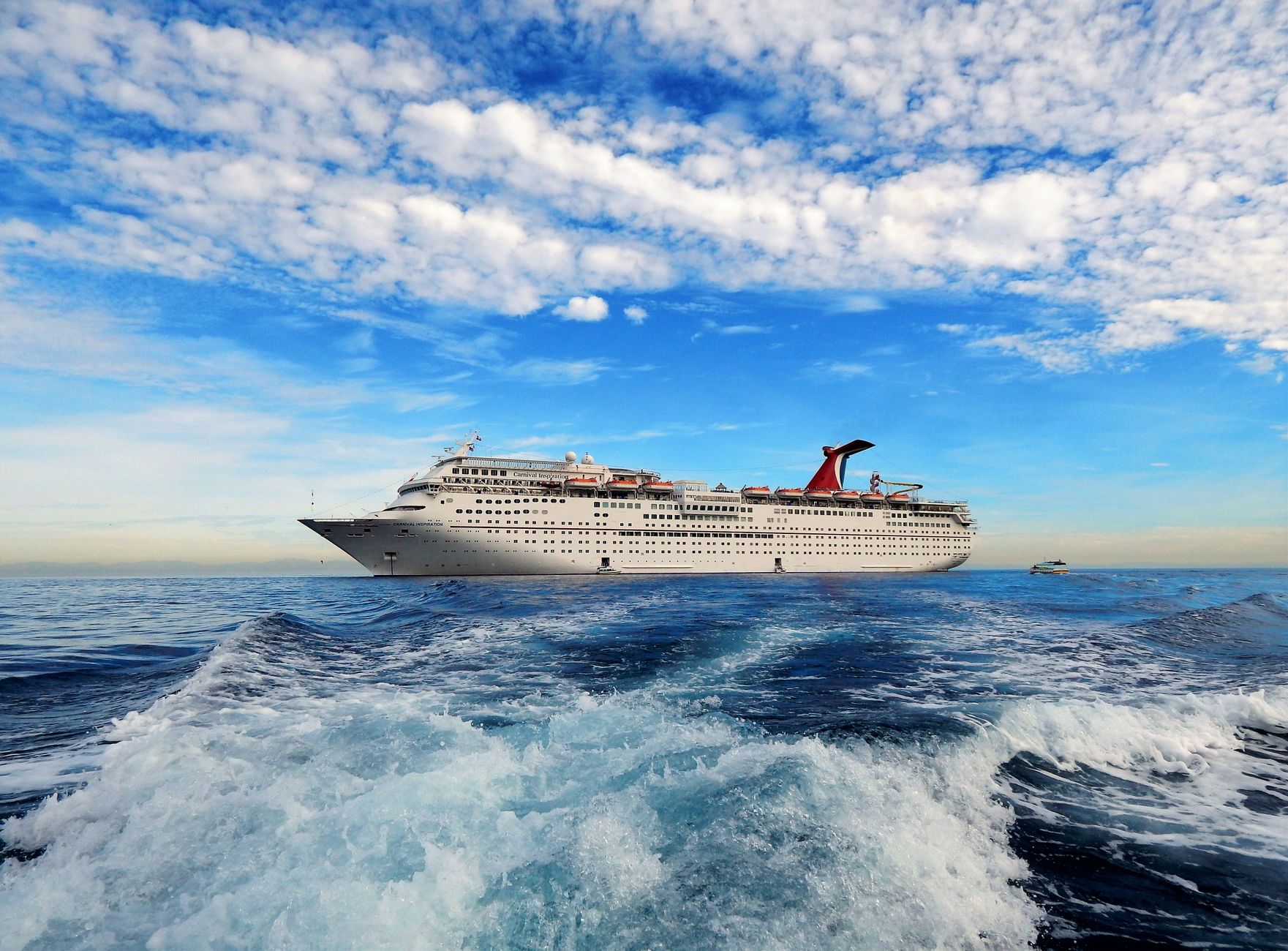 white cruise ship anchored on sea