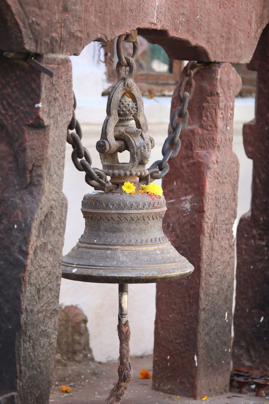 photo of a bell with yellow flowers
