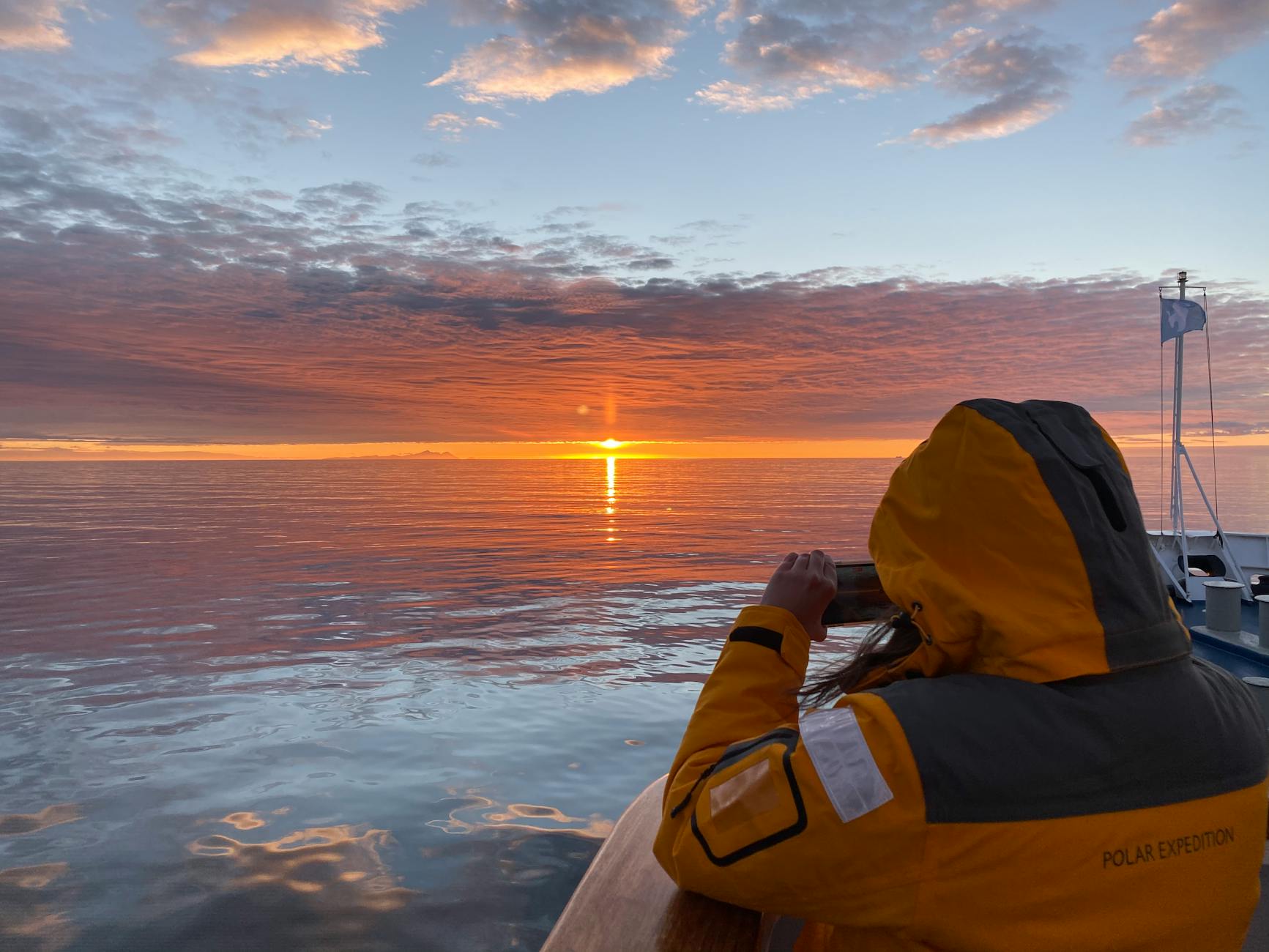 a person looking at the sunset
