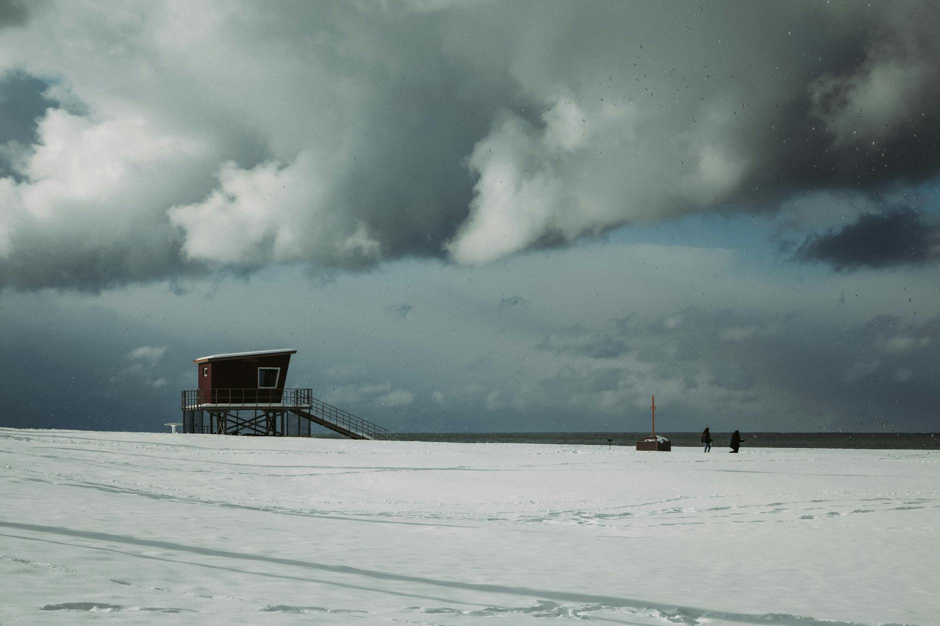 lonely house on snowy seashore
