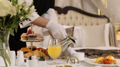 server pouring hot drink