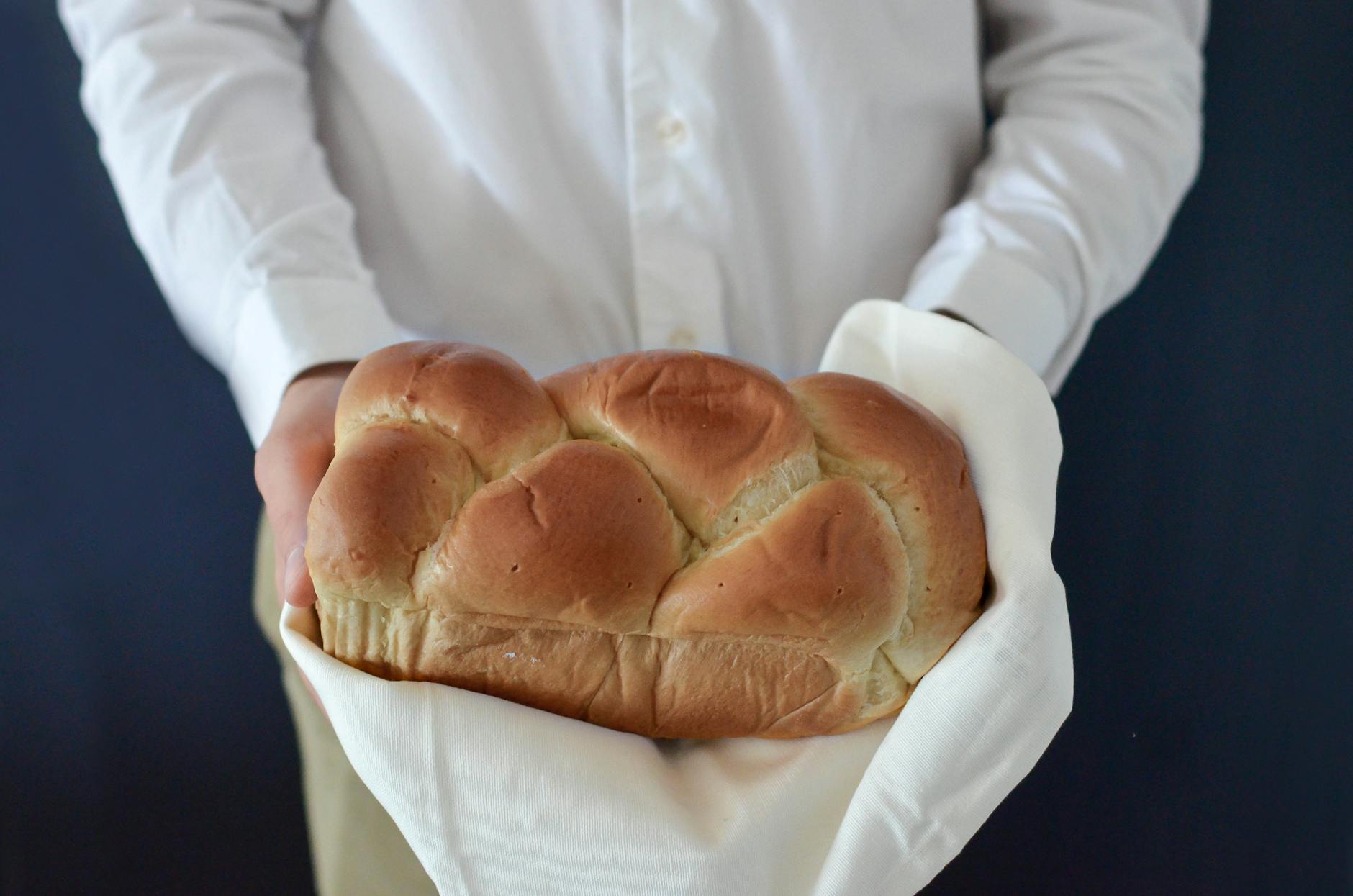 brown bread held by a person