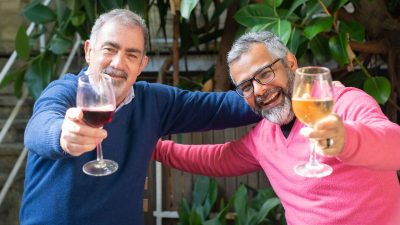 men drinking wine together