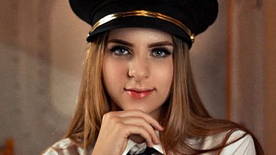 a woman wearing a pilot uniform