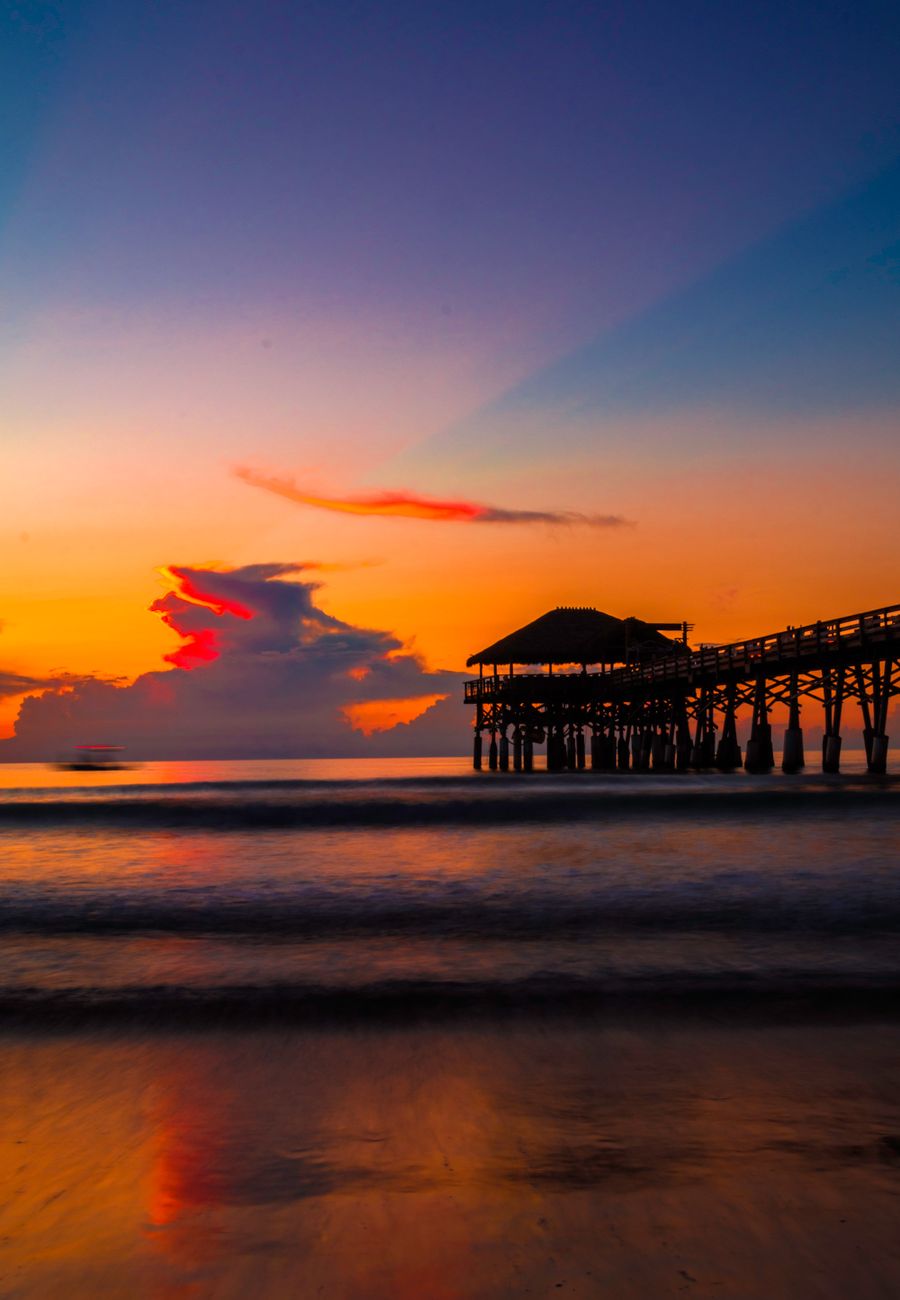 photography of a dock during sunset