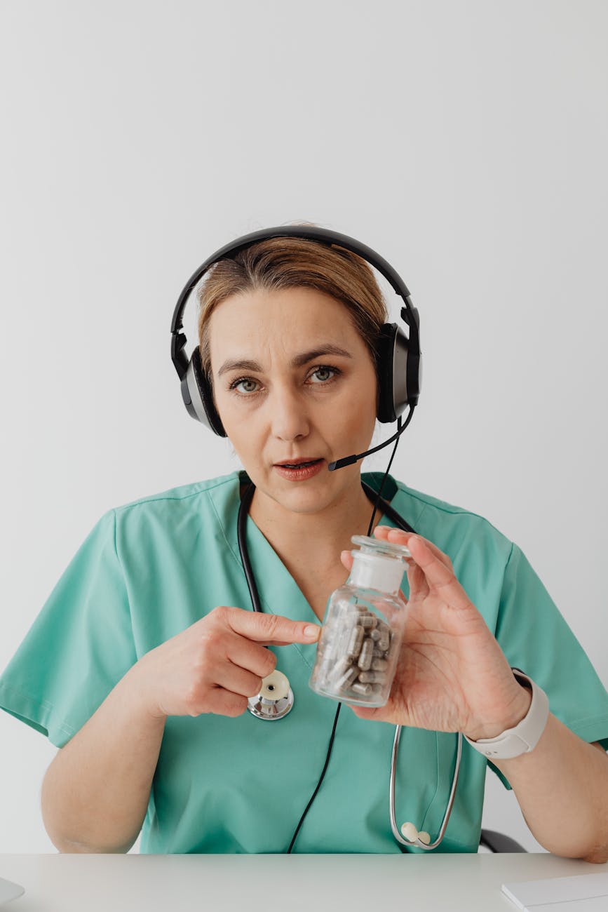 a female doctor holding a bottle with medicines