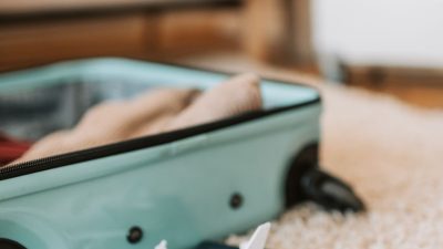 blue suitcase on the floor