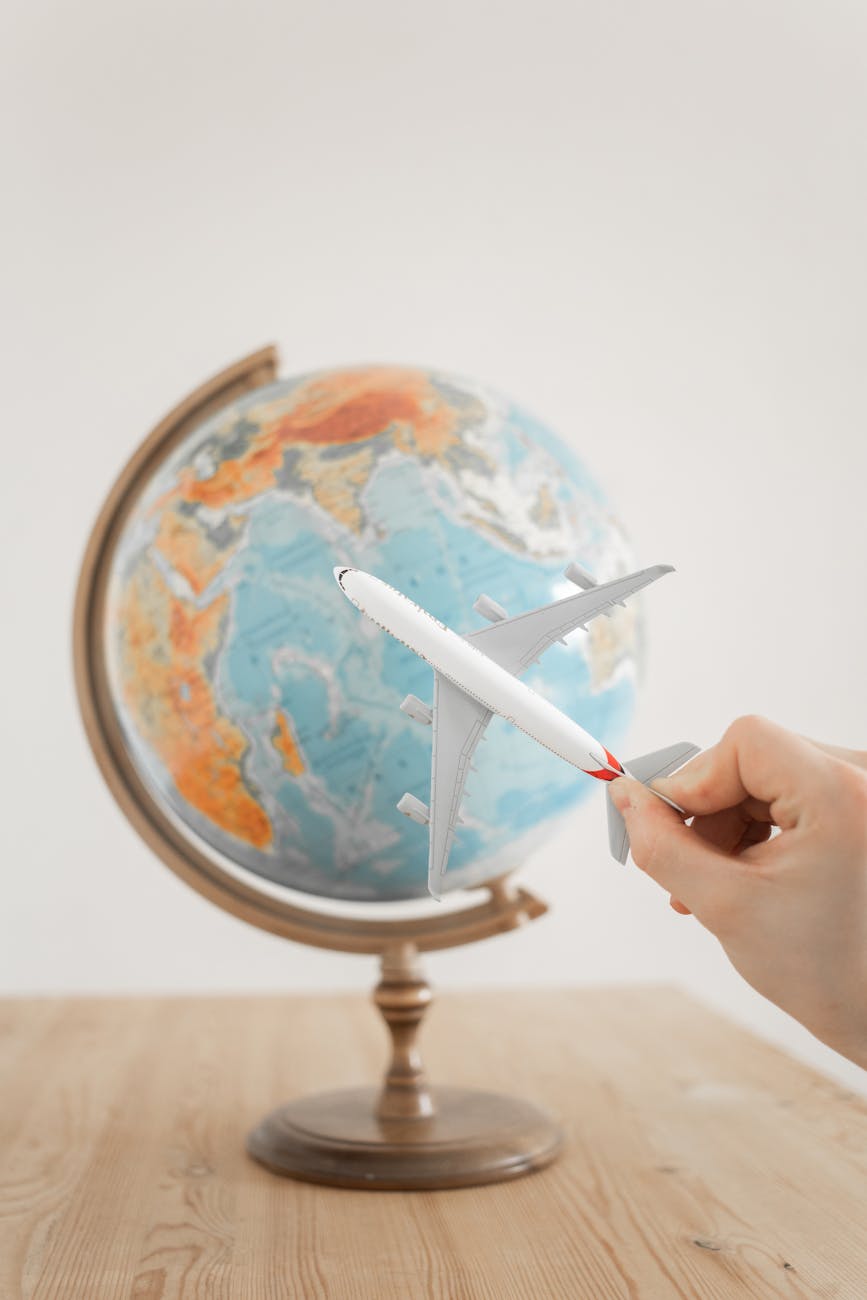 close up shot of a person holding an airplane toy