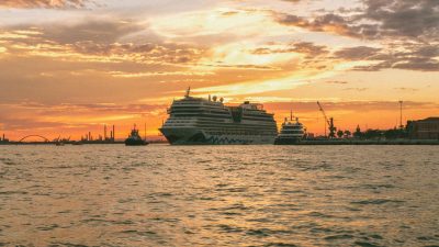 a ship in a marina during the golden hour